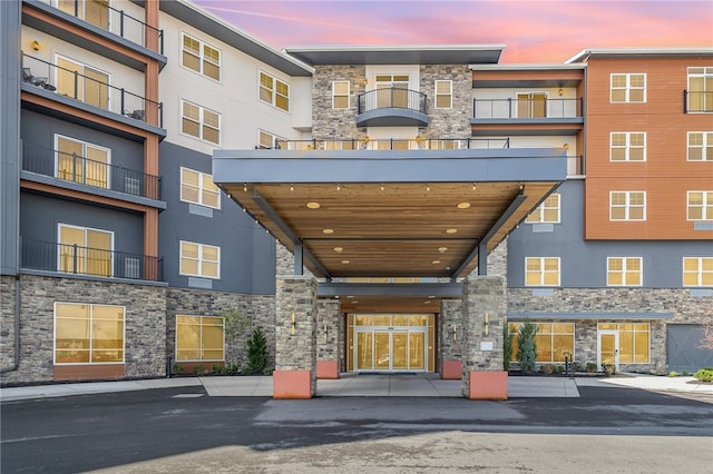 view of outdoor building at dusk