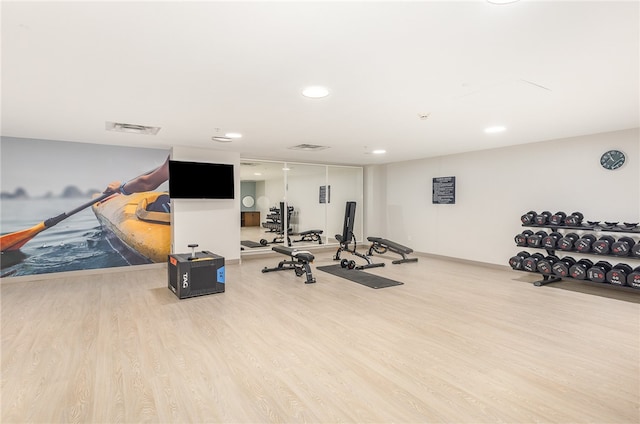 workout room with hardwood / wood-style floors