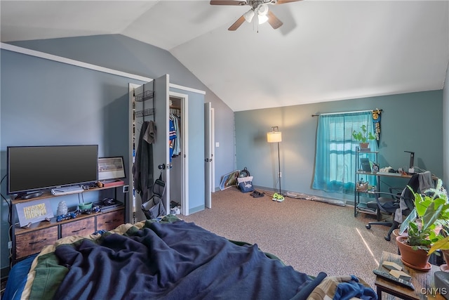 carpeted bedroom featuring lofted ceiling, a closet, and ceiling fan