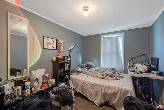 bedroom with crown molding and carpet floors