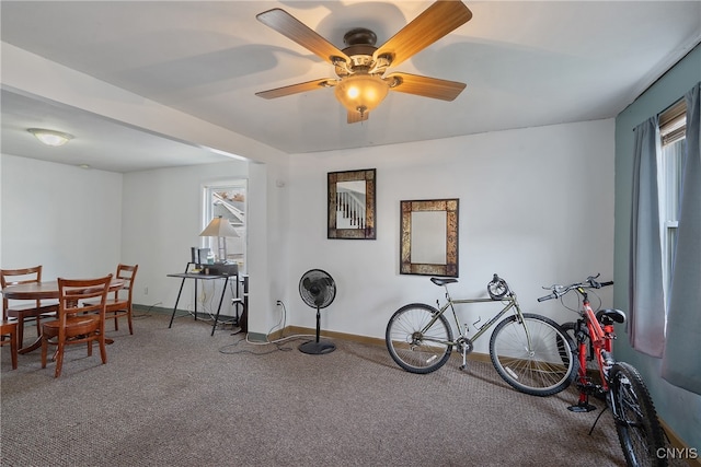 miscellaneous room featuring ceiling fan and carpet