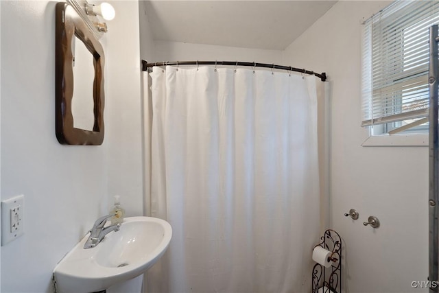 26 W 2nd St, Oswego-City, NY 13126 - full bathroom featuring plenty of natural light, curtained shower, and a sink