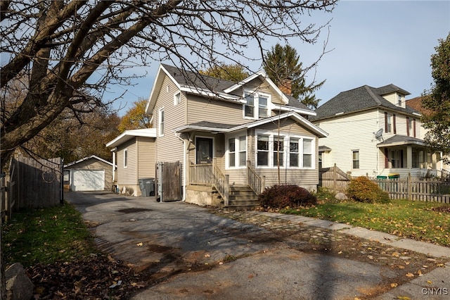 view of front facade with an outdoor structure and a garage