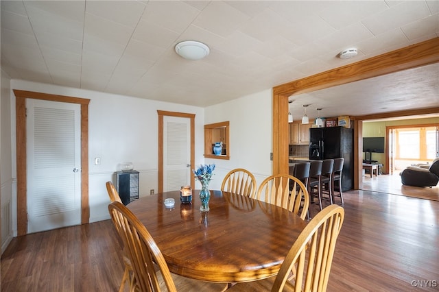 dining area featuring dark hardwood / wood-style floors