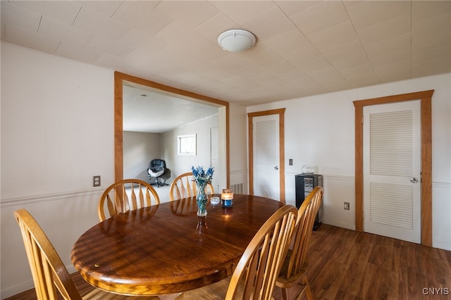 dining space featuring dark hardwood / wood-style flooring