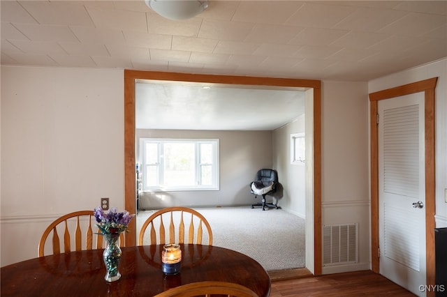 dining space featuring hardwood / wood-style floors