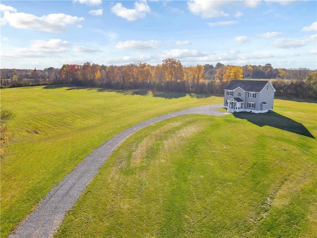 birds eye view of property with a rural view