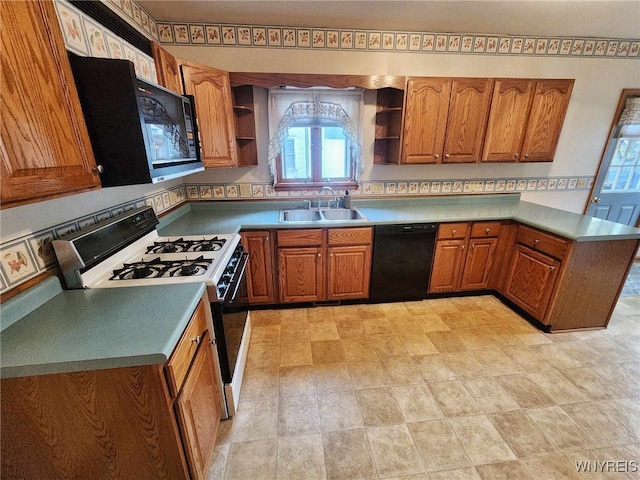 kitchen featuring dishwasher, sink, and white range