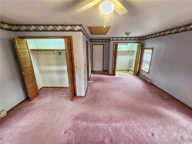 unfurnished bedroom featuring ceiling fan, carpet, and baseboard heating