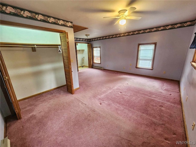 unfurnished bedroom with carpet flooring, a closet, and ceiling fan