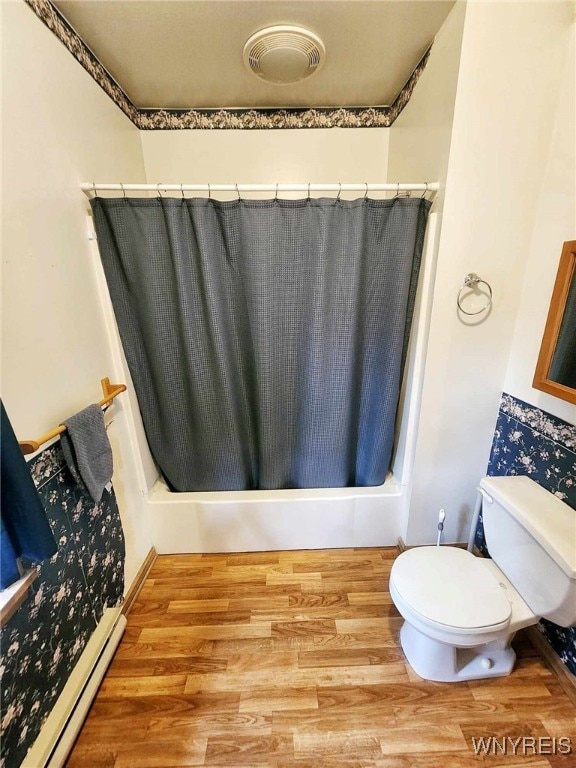 bathroom with toilet, shower / tub combo with curtain, hardwood / wood-style flooring, and a baseboard radiator