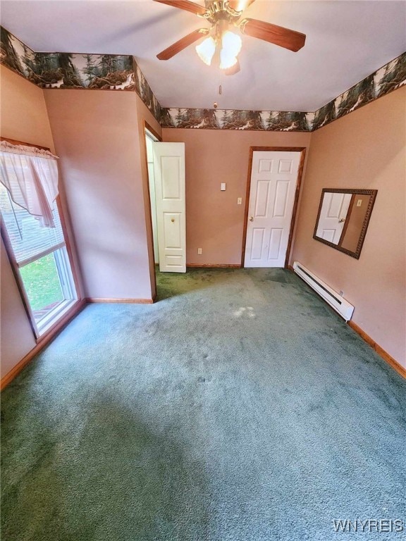 empty room featuring a baseboard heating unit, carpet flooring, and ceiling fan