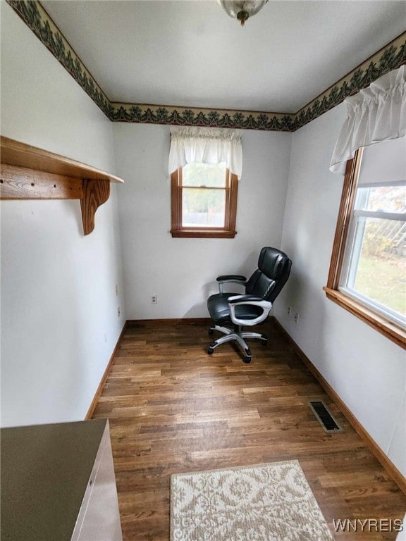 unfurnished room with hardwood / wood-style flooring