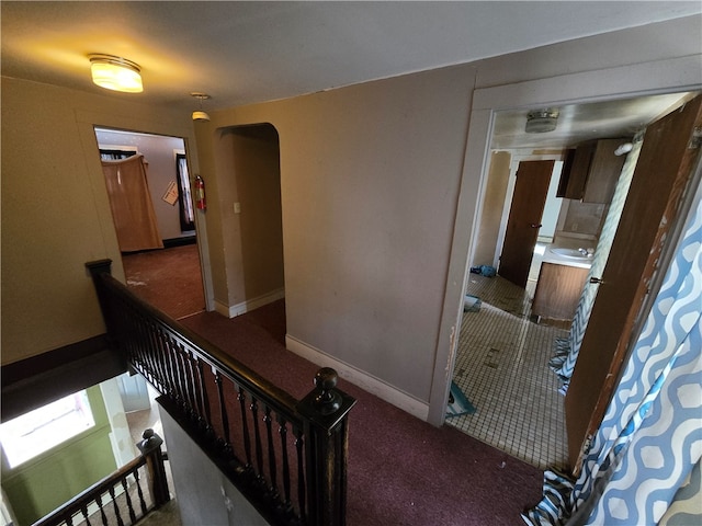 corridor with dark tile patterned flooring