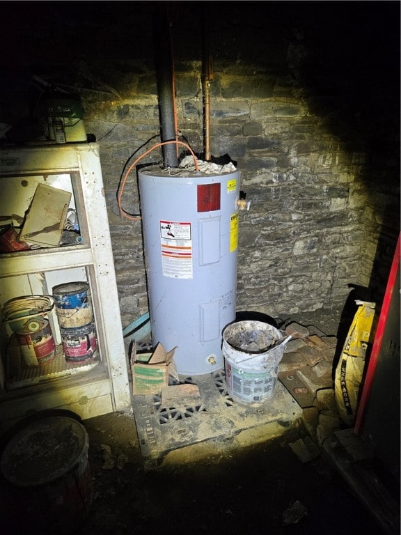 utility room featuring electric water heater