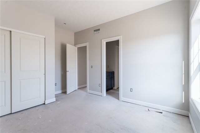 unfurnished bedroom with a closet