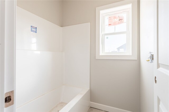 bathroom featuring shower with separate bathtub