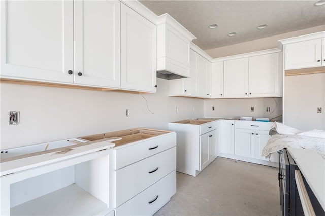 laundry area with a textured ceiling