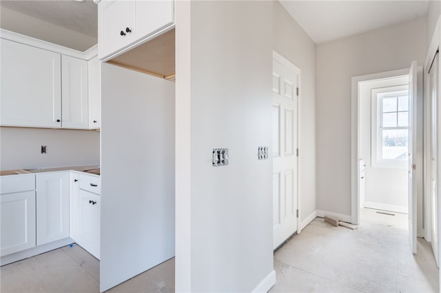 interior space with white cabinetry