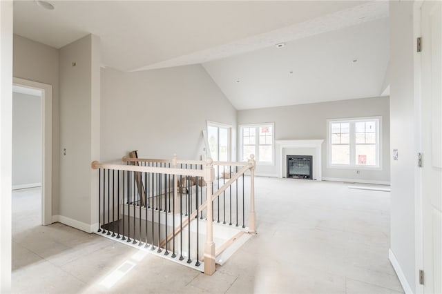 hallway with high vaulted ceiling