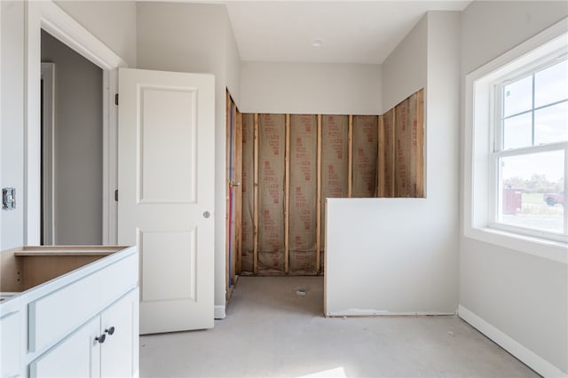 bathroom with concrete flooring