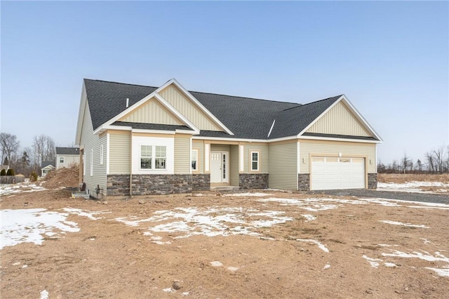 craftsman-style house with a garage, stone siding, board and batten siding, and a shingled roof