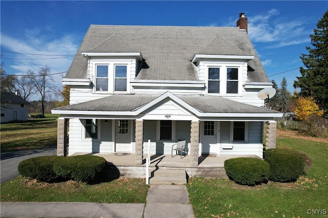 view of front facade featuring a porch and a front yard