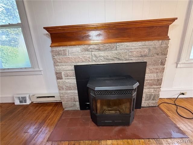 room details with a baseboard radiator and hardwood / wood-style floors