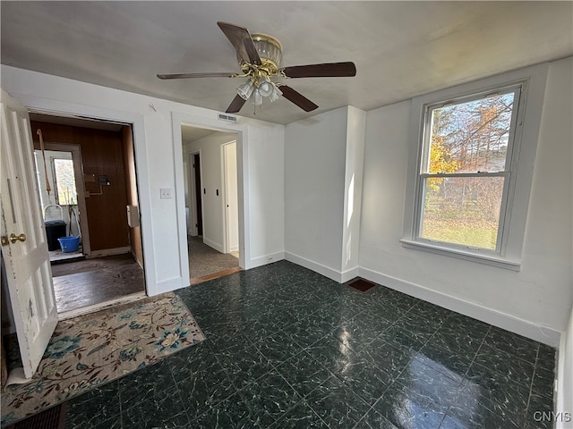 unfurnished room featuring ceiling fan