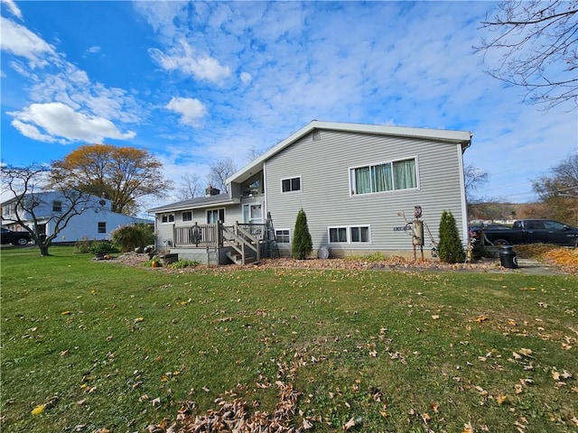 42 Pine Cir, Big Flats, NY 14845 - rear view of property with a lawn and a deck
