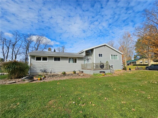 42 Pine Cir, Big Flats, NY 14845 - view of front of property featuring a front yard, a chimney, and a deck