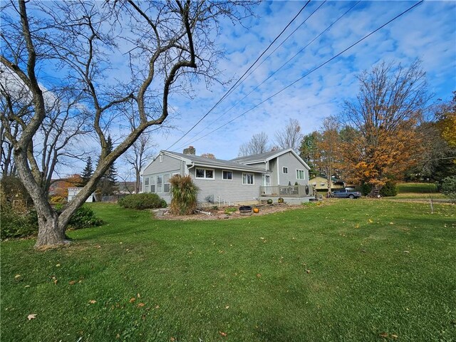 42 Pine Cir, Big Flats, NY 14845 - rear view of house with a yard