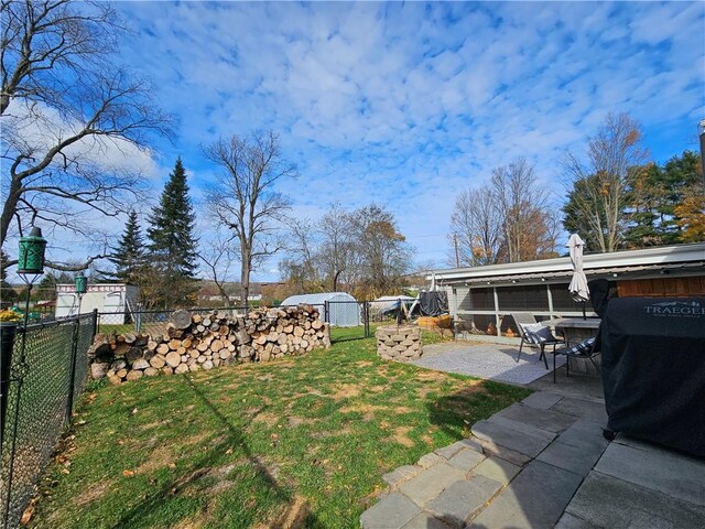 42 Pine Cir, Big Flats, NY 14845 - view of yard with a shed, a patio area, and an outdoor structure
