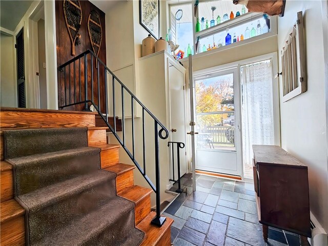 42 Pine Cir, Big Flats, NY 14845 - foyer with stone tile flooring and stairs