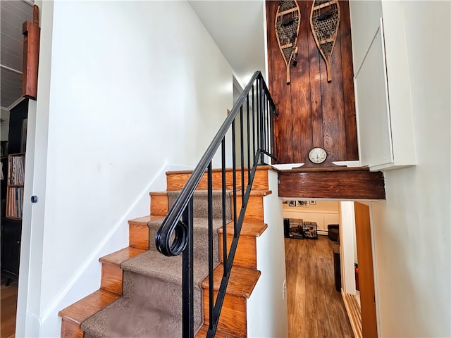 stairs with wood-type flooring