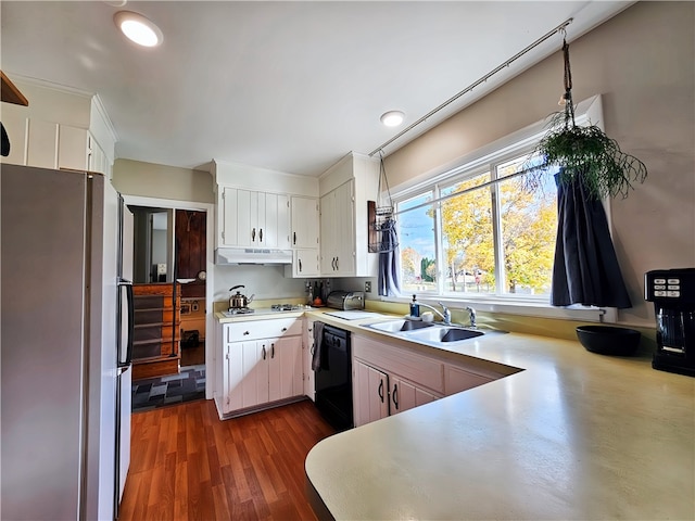 kitchen with black dishwasher, sink, stainless steel fridge, white cabinetry, and dark wood-type flooring