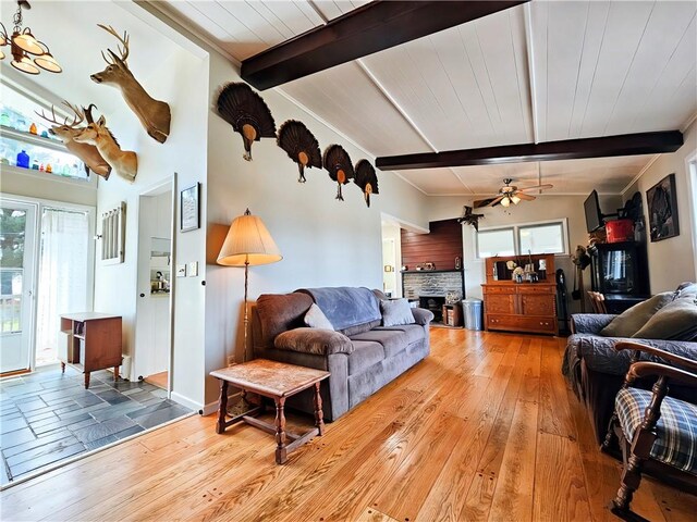 42 Pine Cir, Big Flats, NY 14845 - living area featuring ceiling fan, beam ceiling, light wood finished floors, and a fireplace