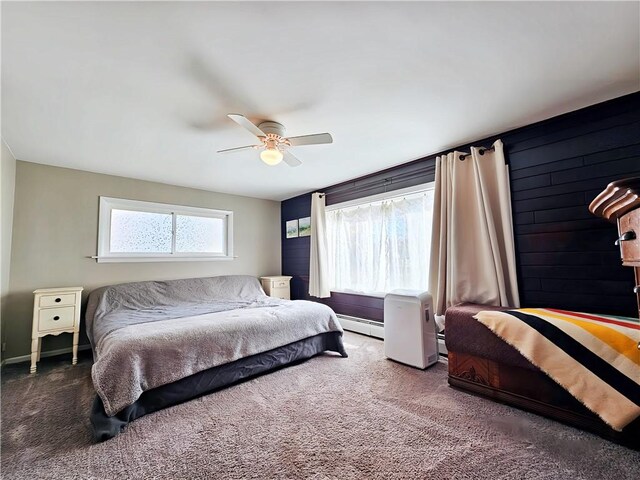 42 Pine Cir, Big Flats, NY 14845 - carpeted bedroom with a baseboard heating unit, a ceiling fan, and baseboards