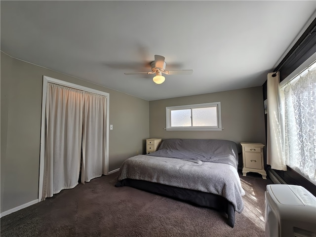 carpeted bedroom featuring ceiling fan