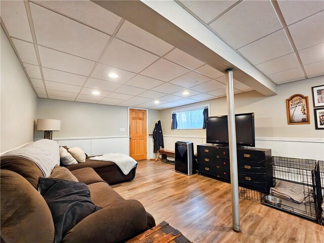 42 Pine Cir, Big Flats, NY 14845 - living area with wood finished floors, a paneled ceiling, and wainscoting