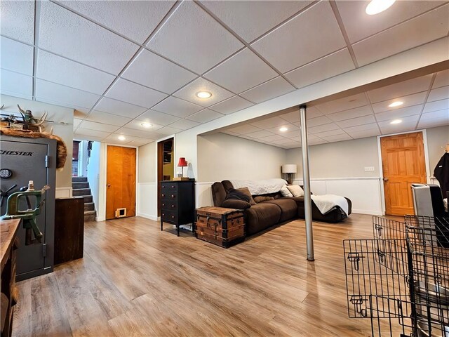 42 Pine Cir, Big Flats, NY 14845 - living area with light wood-style floors, baseboards, a paneled ceiling, stairs, and recessed lighting