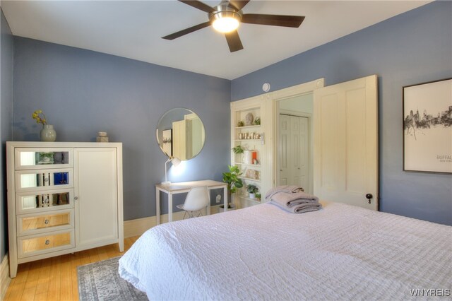 bedroom featuring a closet, light hardwood / wood-style floors, and ceiling fan