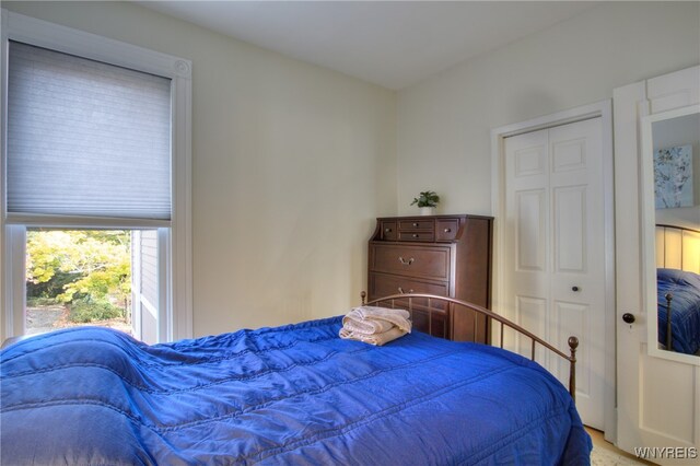 carpeted bedroom with a closet