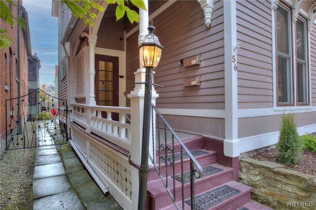 entrance to property featuring covered porch