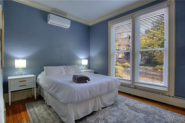 bedroom with a baseboard radiator, hardwood / wood-style floors, a wall mounted AC, and multiple windows