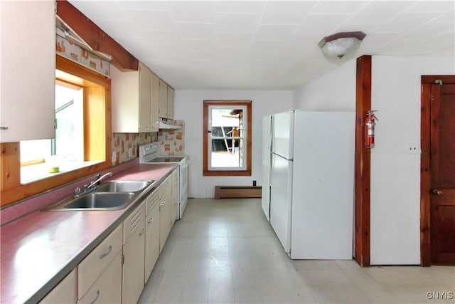 6736 Pine Grove Rd, Watson, NY 13343 - kitchen with white appliances, a baseboard radiator, under cabinet range hood, and light countertops