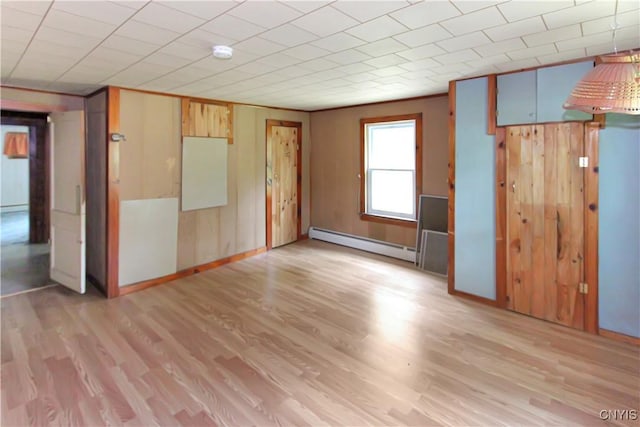 6736 Pine Grove Rd, Watson, NY 13343 - unfurnished room with baseboard heating, light wood-type flooring, and a smoke detector