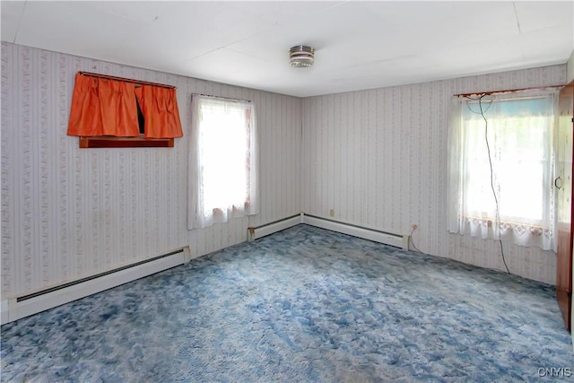 6736 Pine Grove Rd, Watson, NY 13343 - carpeted empty room with a baseboard heating unit and wallpapered walls