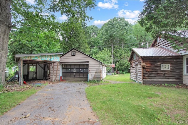 6736 Pine Grove Rd, Watson, NY 13343 - detached garage with asphalt driveway