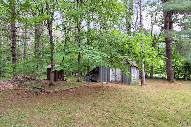 6736 Pine Grove Rd, Watson, NY 13343 - view of grassy yard with an outdoor structure and a pole building